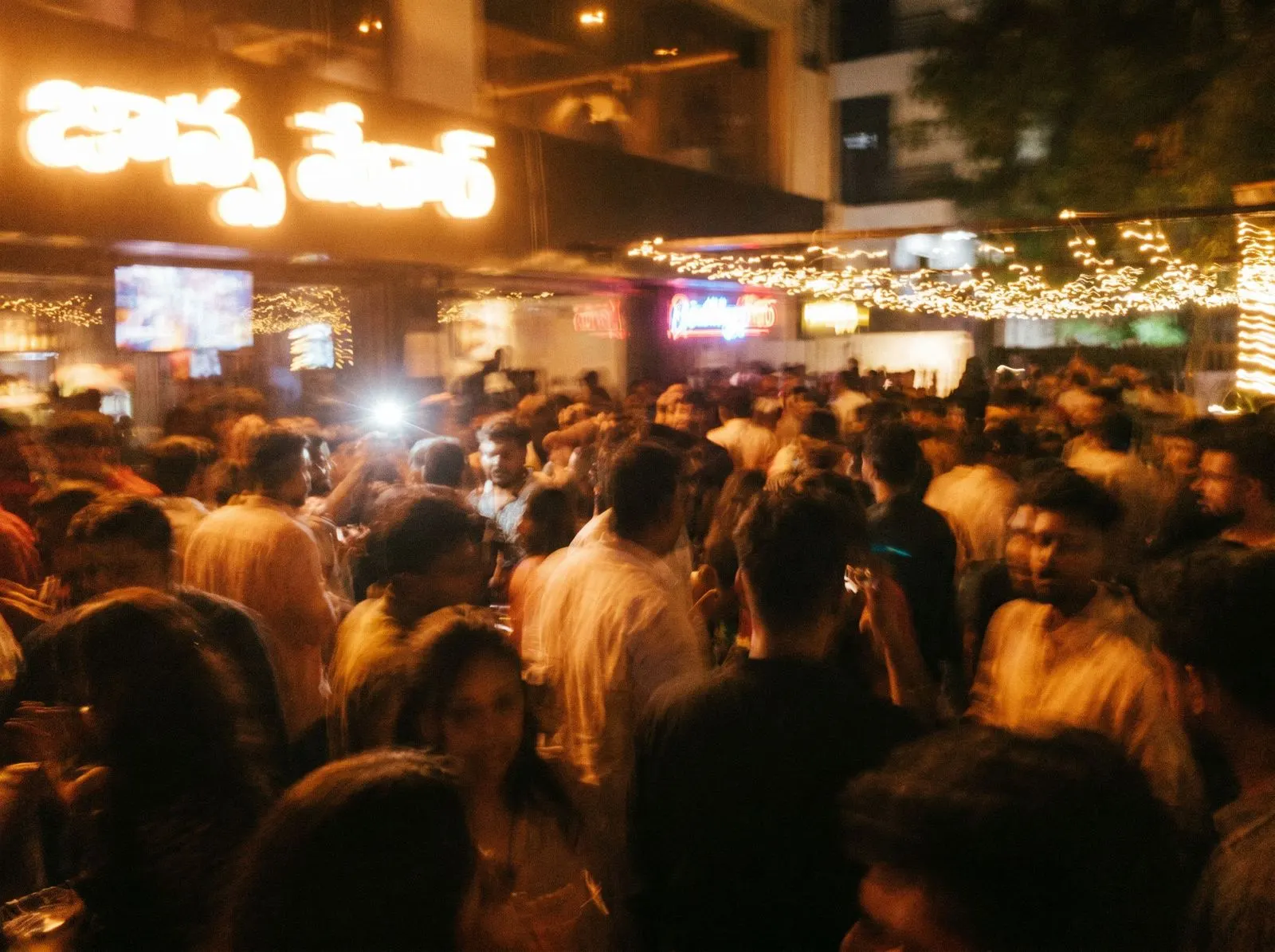 Motion-blurred crowd in a bar