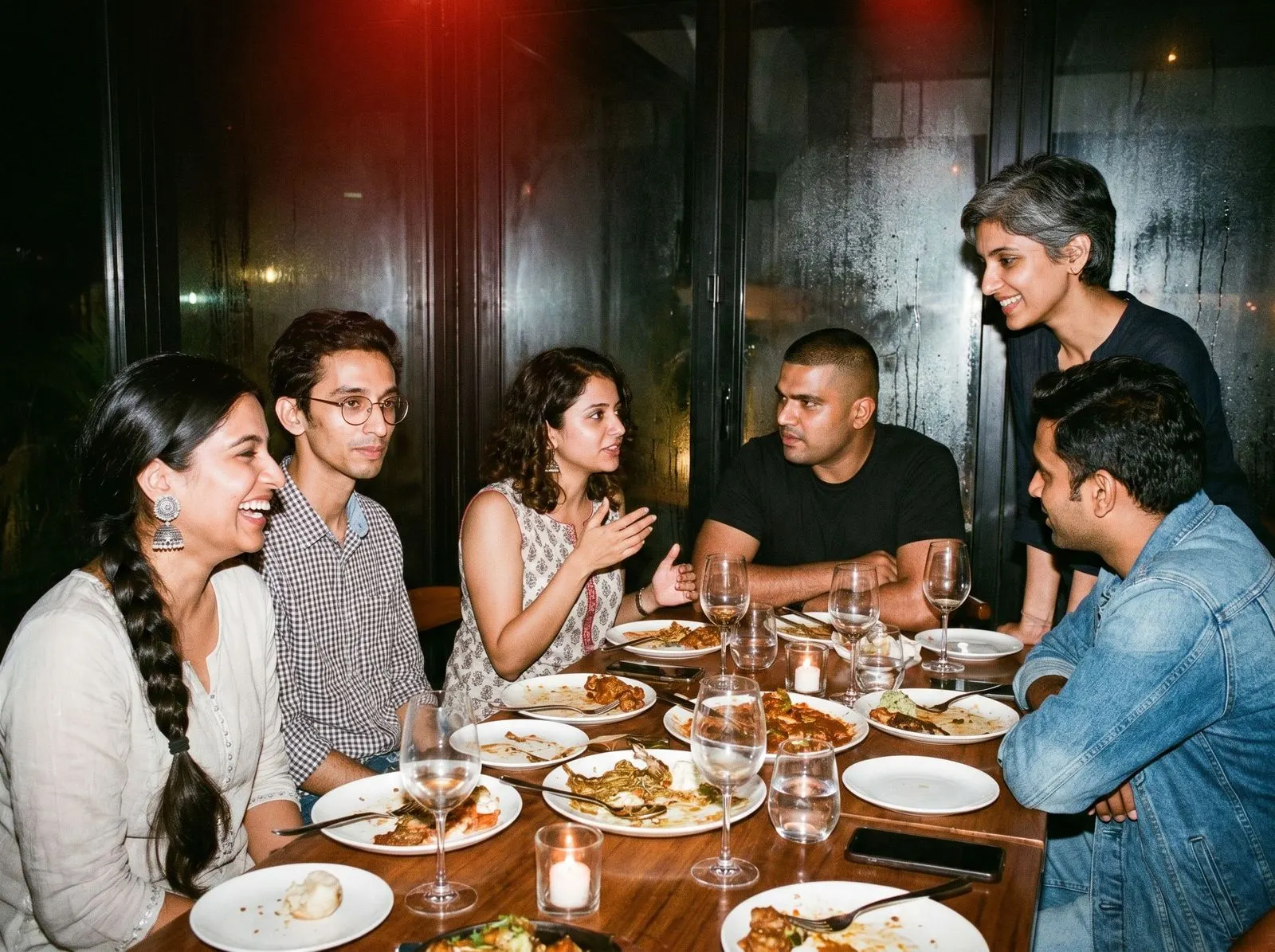 A long chef's-table dinner at a dim supper club